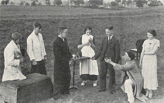 Mixed drama group rehearses in a disused railway cutting